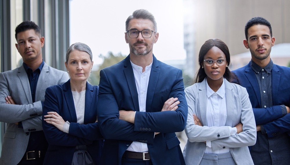 Diverse team of confident legal professionals standing together