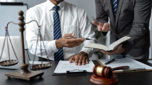 SSDI lawyer explaining back pay summary to client in office setting