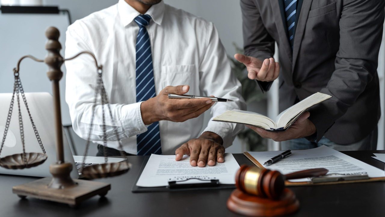 SSDI lawyer explaining back pay summary to client in office setting