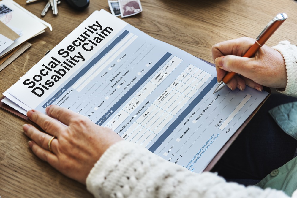Person filling out a Social Security Disability Claim form
