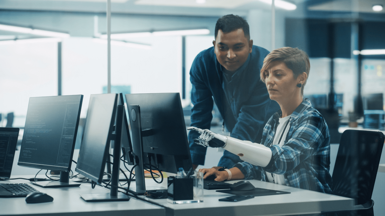 Woman with prosthetic arm working on computer — what proof is needed for SSDI?