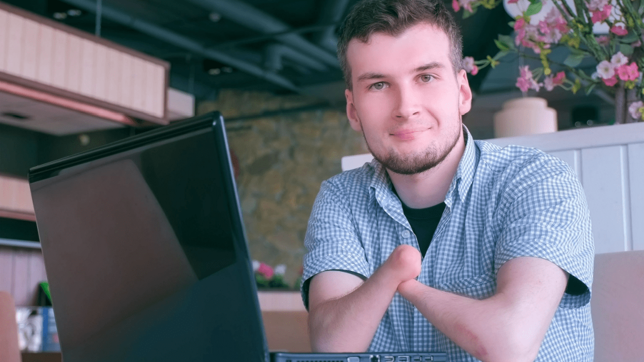 Man researching disability benefits online at laptop computer