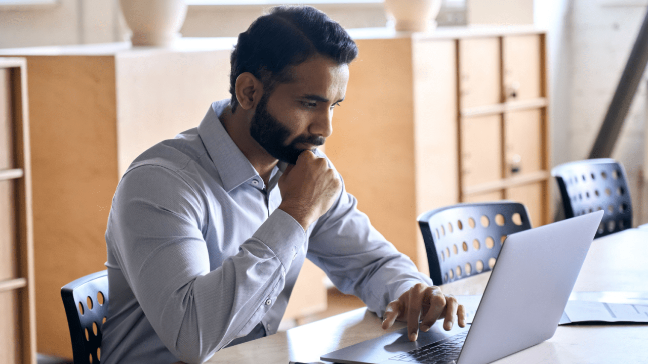 Man researching can I collect SSI and SSDI at the same time on laptop computer