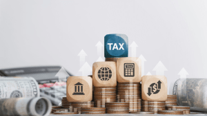 Tax blocks and coins illustrating does SSDI get taxed concepts for disability benefits