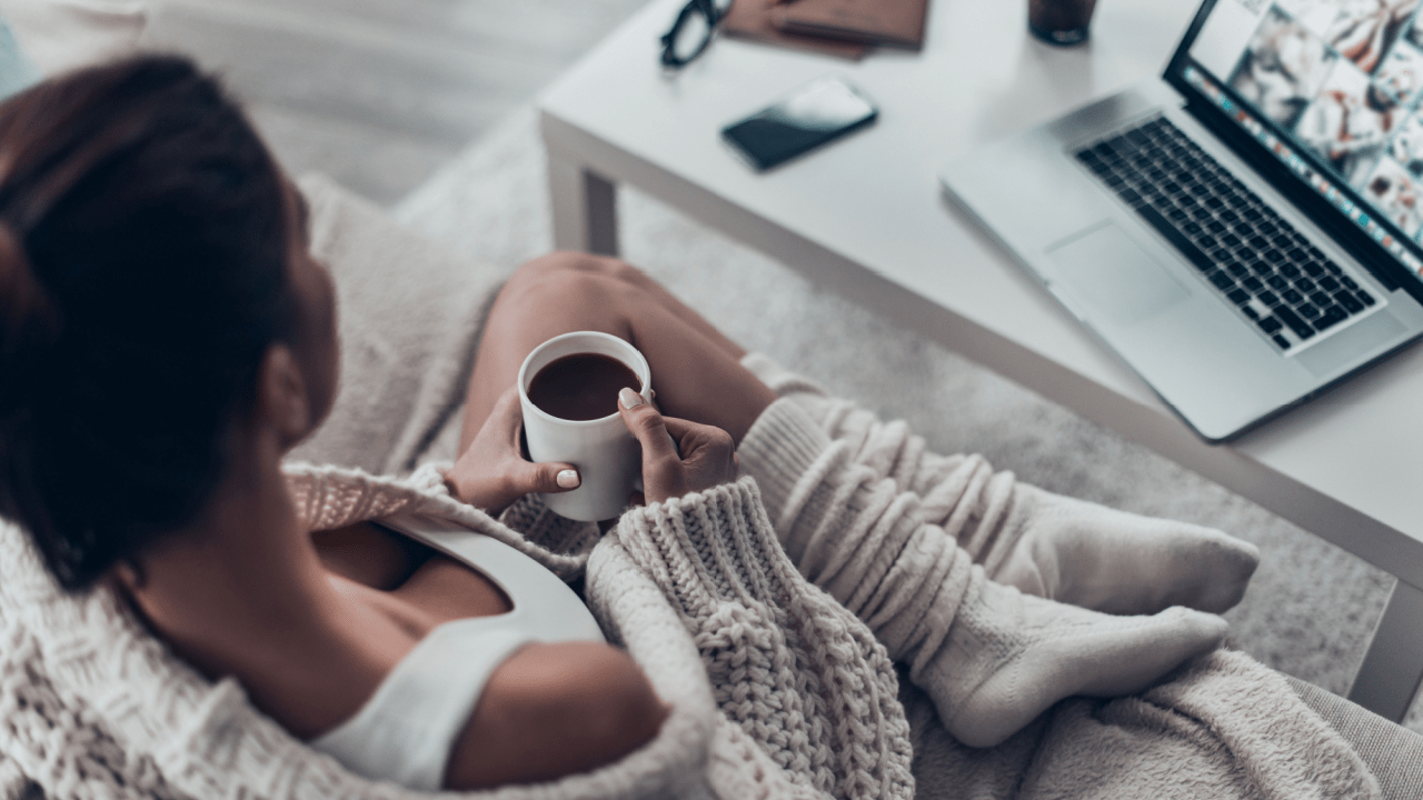 Person researching how long does SSDI last while working on laptop at home with coffee