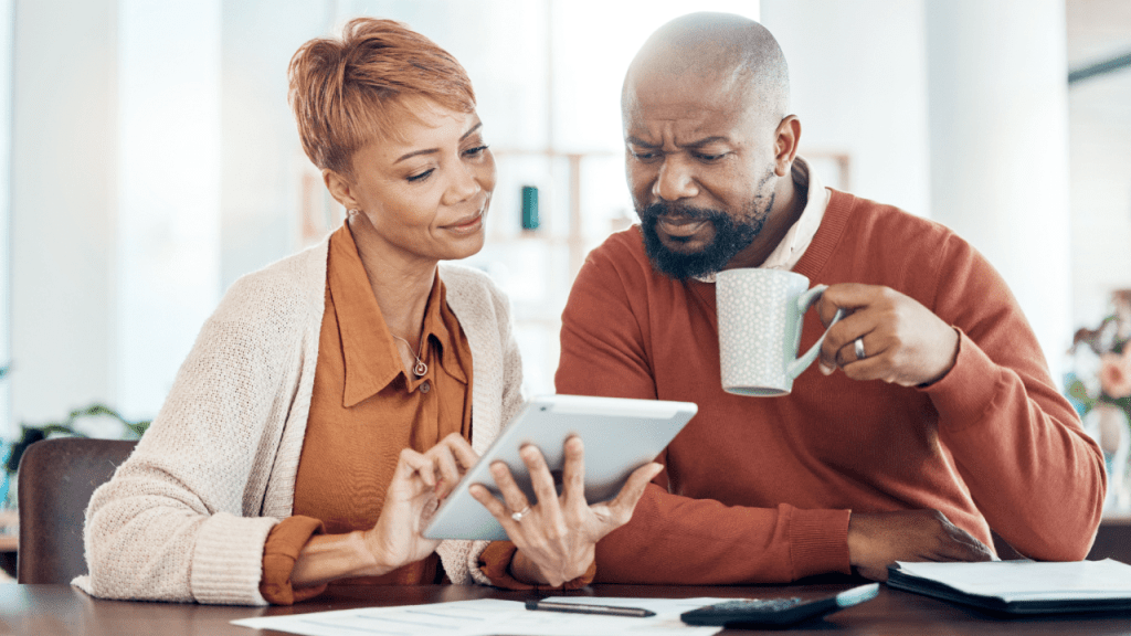 Couple reviewing how much can you make working while on disability income limits on a tablet