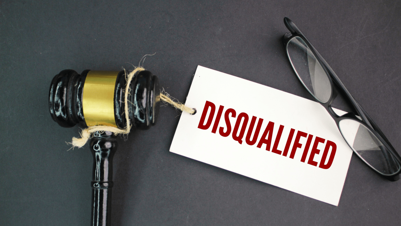 Gavel and disqualified tag symbolizing what are the 3 things that will disqualify you from disability benefits