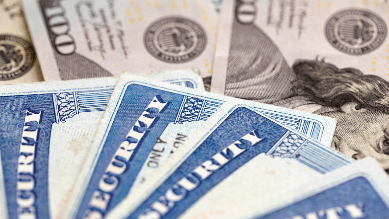 Social Security cards with cash showing what does SSI pay monthly benefits