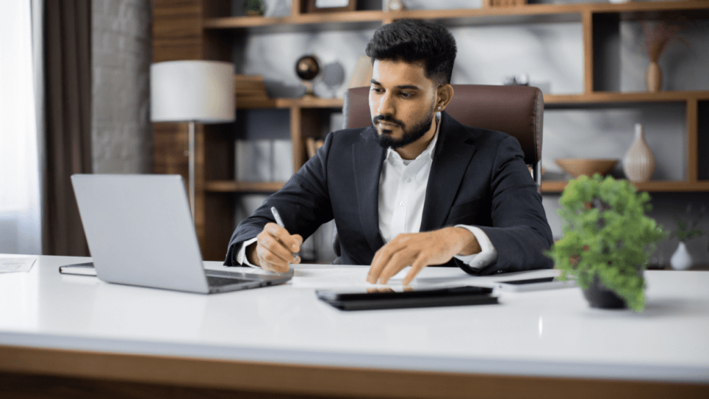 Professional man researching why would someone switch from SSI to SSDI benefits at office desk with laptop