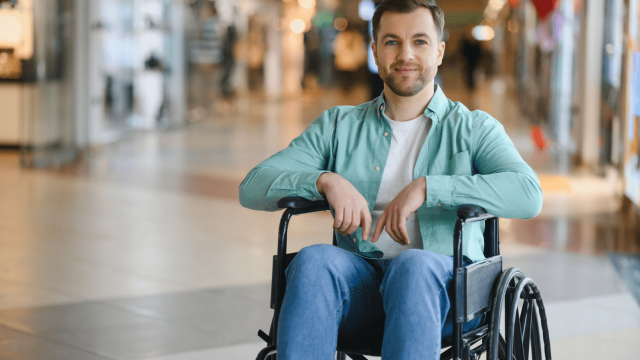 Confident man in wheelchair at shopping center considering finances - do you pay taxes on SSDI benefits