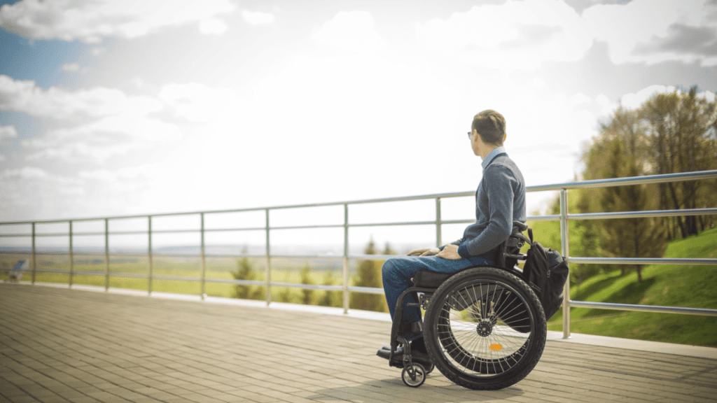 Person in wheelchair contemplating financial security - is SSDI more money than SSI disability benefits