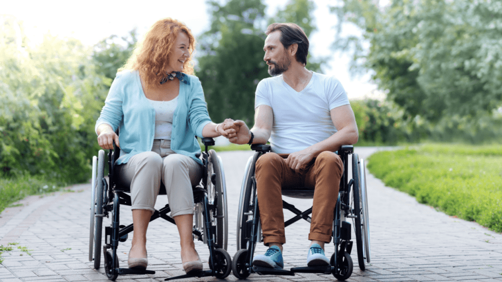 Middle-aged couple in wheelchairs wondering if it is easier to get SSDI at age 50