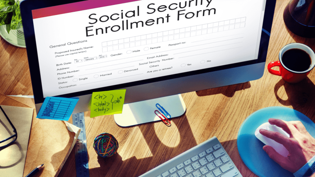 Person completing Social Security Disability rules and requirements application form on computer screen with workspace setup