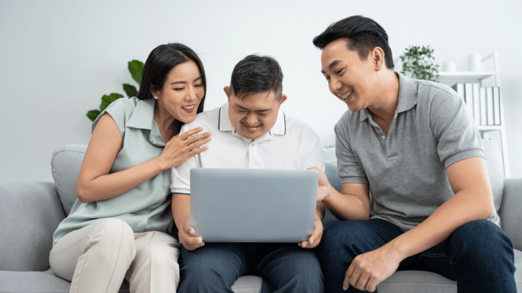 Family reviewing what are the conditions for SSDI eligibility requirements on laptop computer