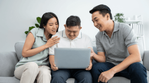 Family reviewing what are the conditions for SSDI eligibility requirements on laptop computer