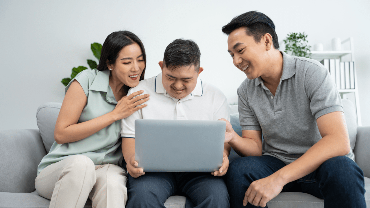 Family reviewing what are the conditions for SSDI eligibility requirements on laptop computer