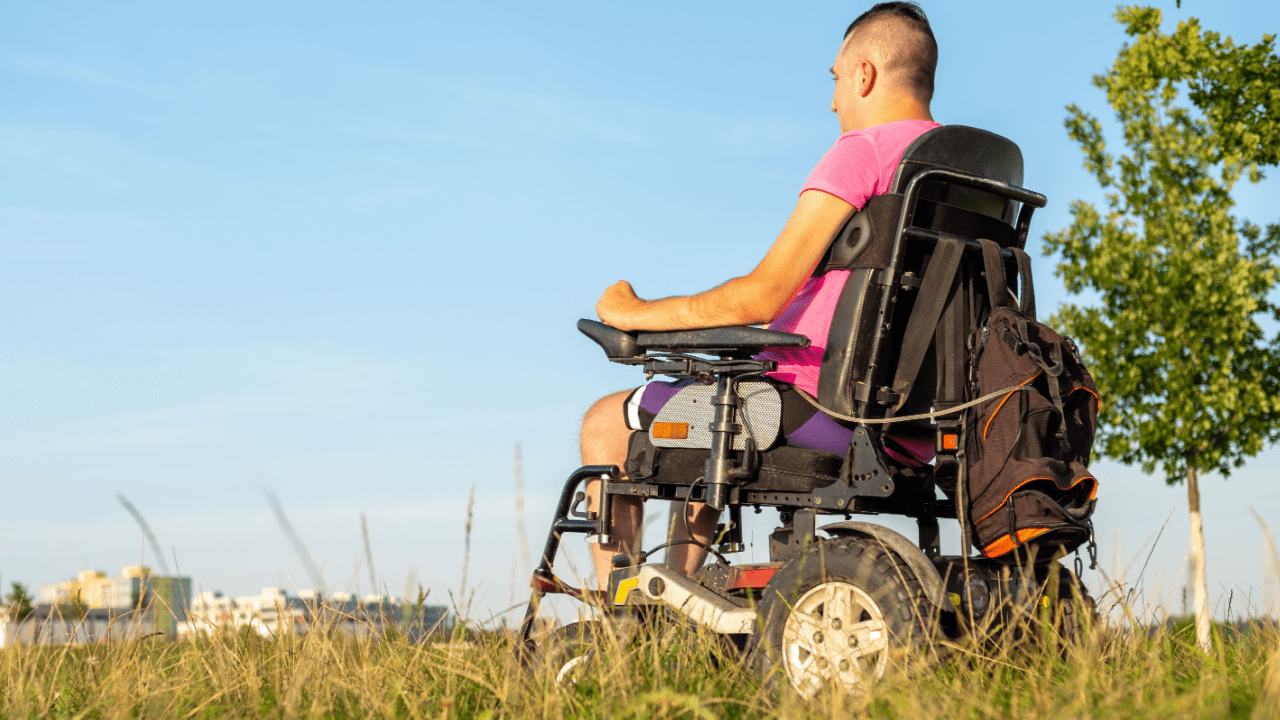 Person in power wheelchair outdoors learning what is the difference between SSD and SSDI