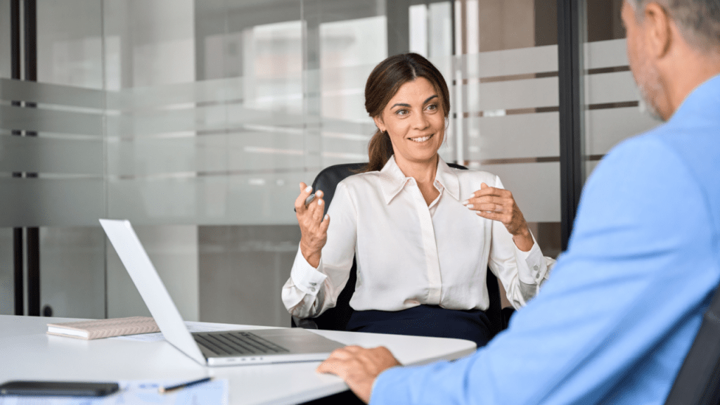 Social security disability attorney consulting with client in modern office setting