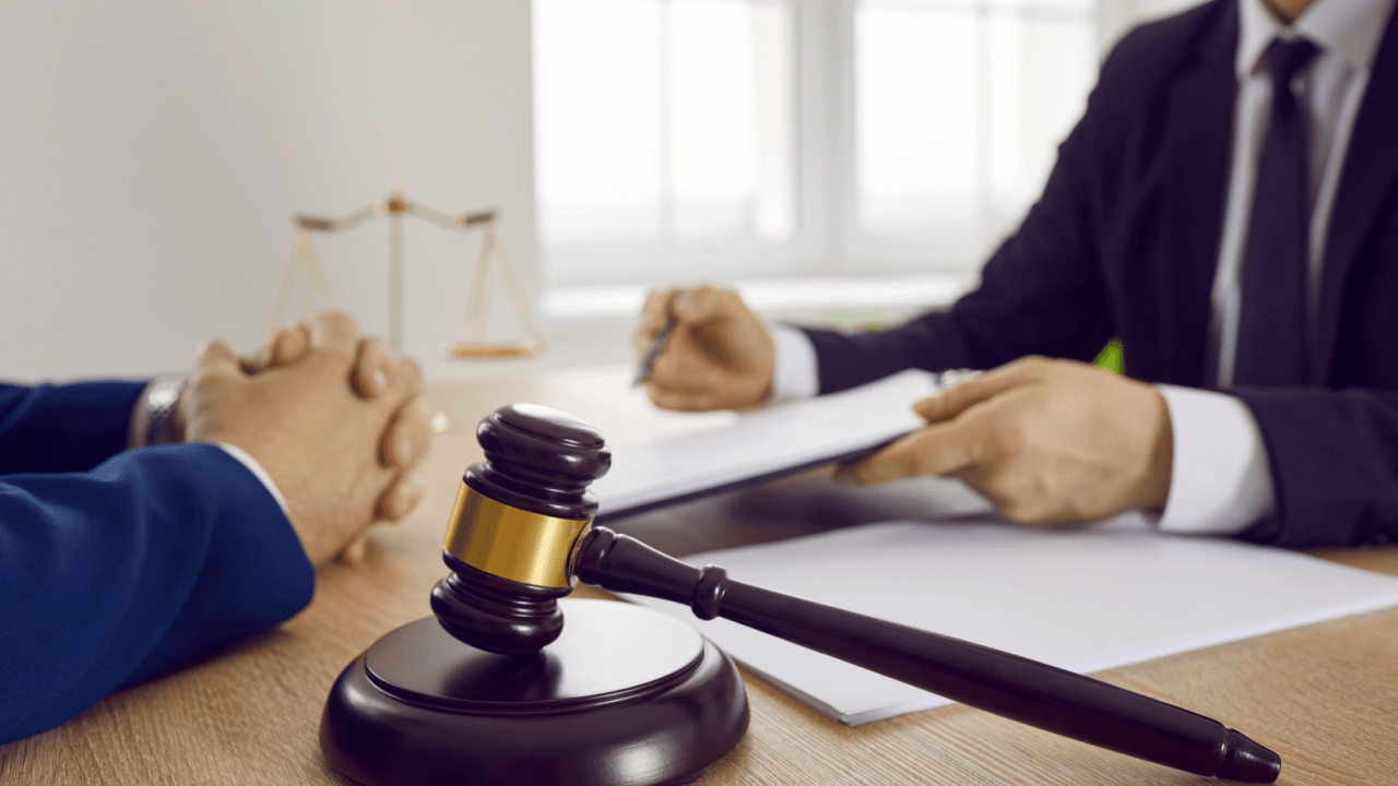 Legal consultation discussing how SSDI reconsideration impact eligibility for benefits with gavel and scales of justice