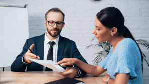 Disability attorney discussing how fast can SSDI be approved with client reviewing application documents