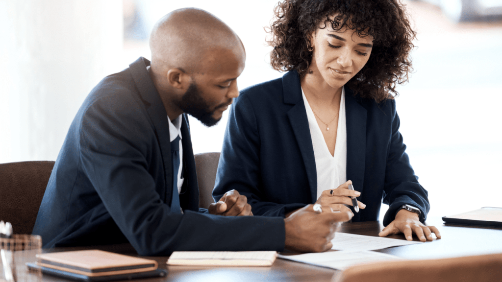 Professionals reviewing SSDI payment documentation to understand average benefits after reconsideration appeal