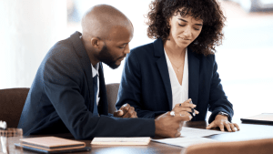 Professionals reviewing SSDI payment documentation to understand average benefits after reconsideration appeal