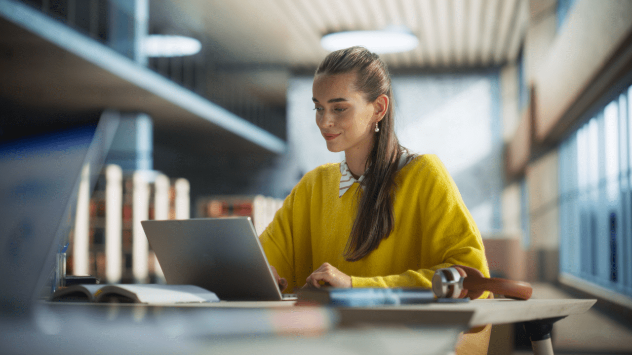 Woman researching what is the most accepted disability on laptop in modern