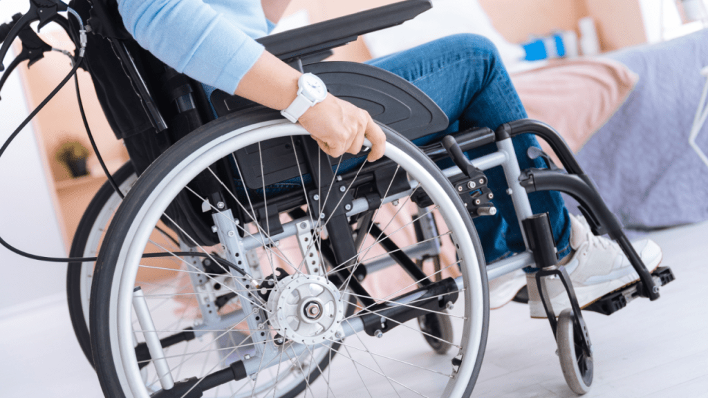 Person in wheelchair considering what percentage of social security disability claims are denied while receiving assistance