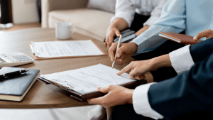 Legal professionals explaining timeline and process of SSDI reconsideration during client consultation meeting