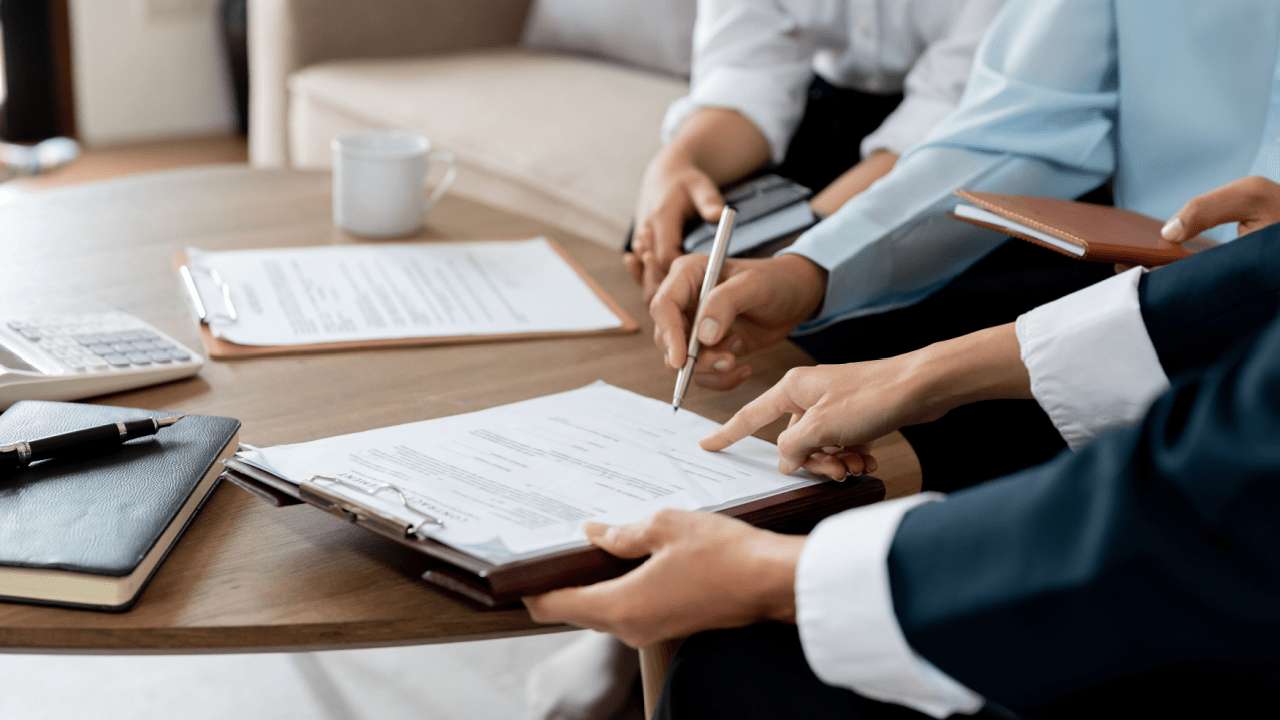 Legal professionals explaining timeline and process of SSDI reconsideration during client consultation meeting