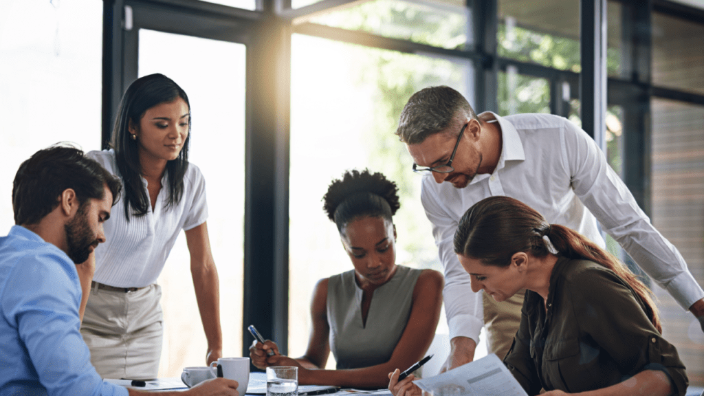 Professional team reviewing SSDI reconsideration documents to understand what does SSDI review include during reconsideration appeals process