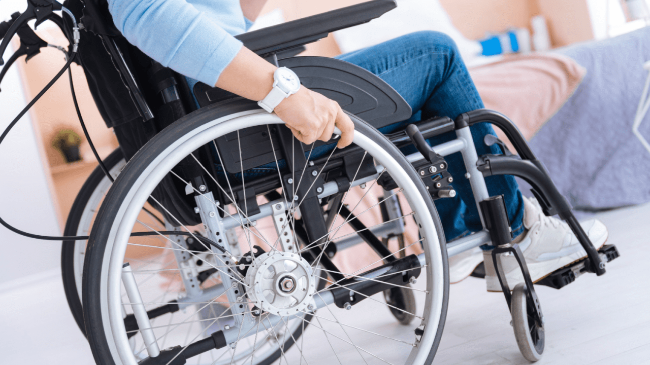 Person in wheelchair considering what percentage of social security disability claims are denied while receiving assistance