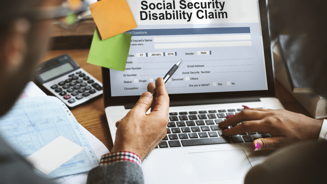 What disqualifies you from getting social security disability claim application form on laptop screen