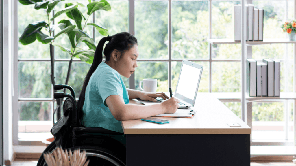Woman learning how to apply for SSDI dependent benefits online at home desk