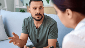 Veteran discussing how to apply for SSDI benefits with disability advocate during consultation