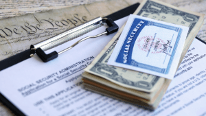 New SSA rules affecting SSDI applicants shown with Social Security card, cash, and SSA documentation