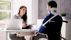 SSDI denial trends in recent years consultation with disability attorney and wheelchair user discussing Social Security application