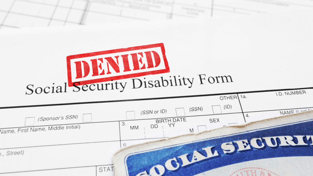 Why most SSDI claims are denied shown on Social Security Disability application form with red denied stamp