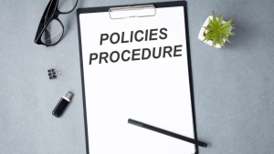 Future changes to SSDI shown on policies procedure clipboard with office supplies