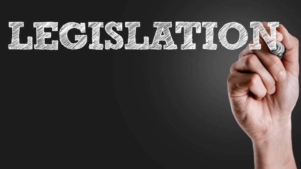 How new legislation could affect SSDI shown by hand writing legislation in chalk on blackboard