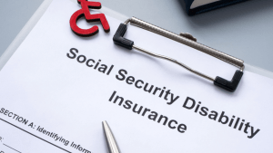 SSDI application by applicant type document with wheelchair symbol and clipboard representing disability insurance claims