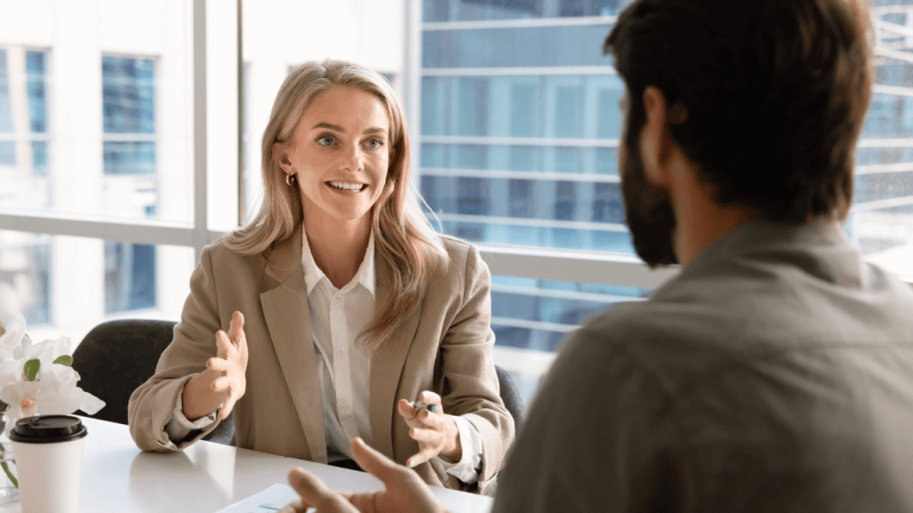 Professional woman explaining what happens at a continuing disability review during office meeting