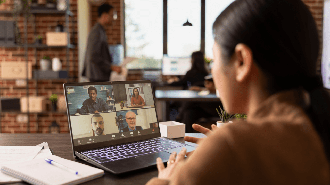 Woman completing a continuing disability review online via video call with SSA representatives on laptop