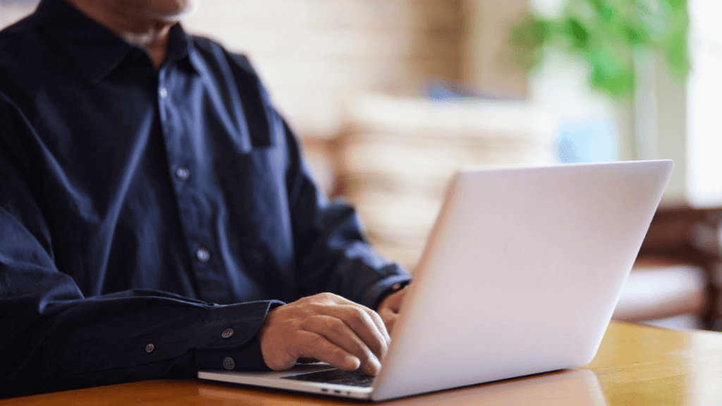 Person on laptop learning what triggers a continuing disability review from Social Security