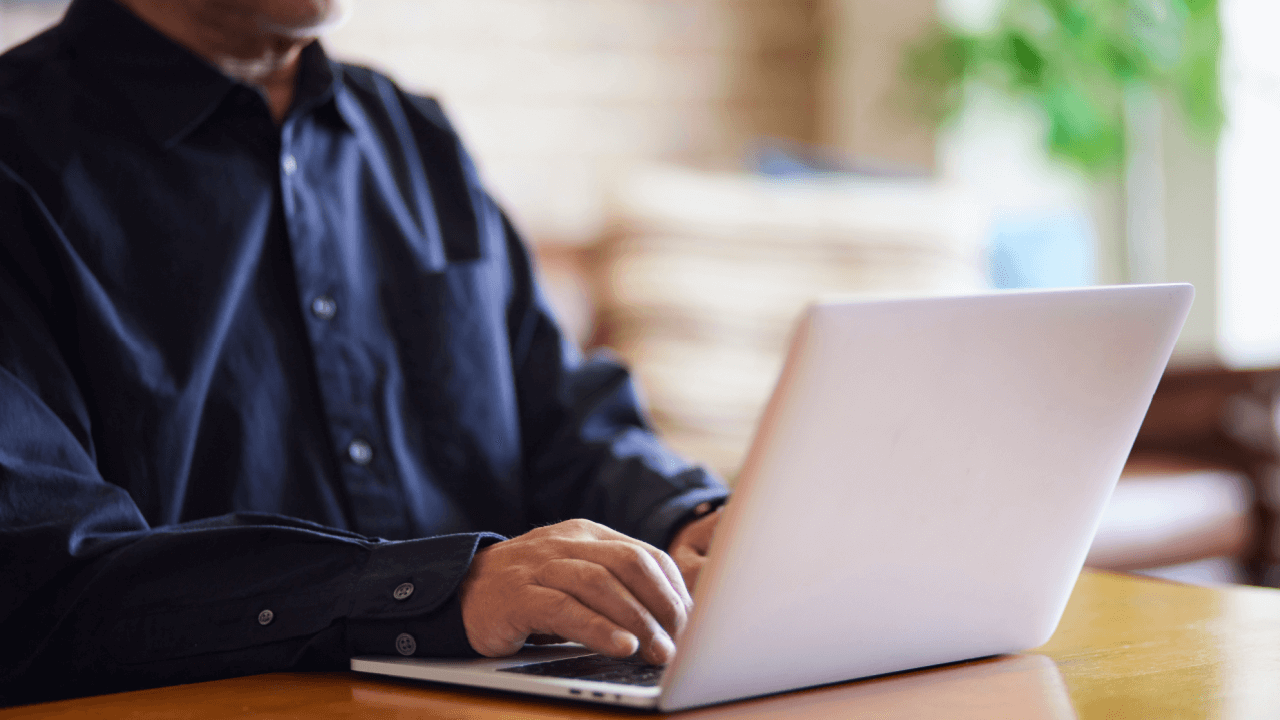 Person on laptop learning what triggers a continuing disability review from Social Security